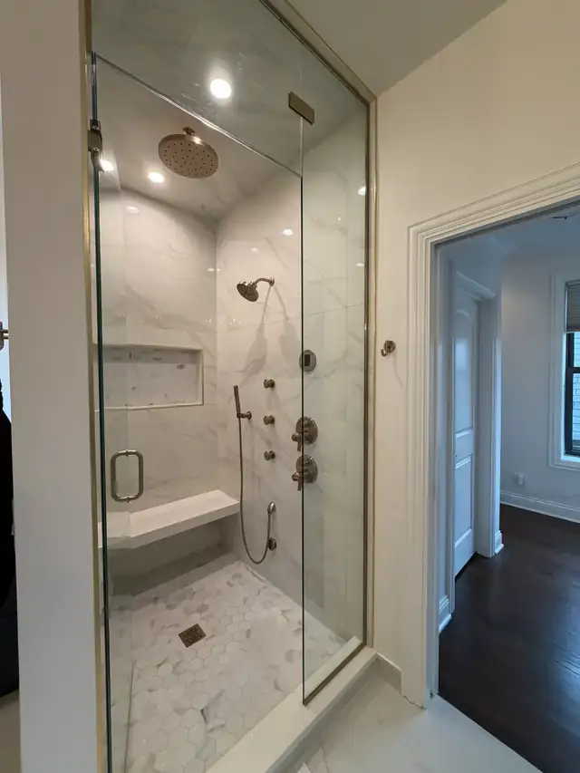 Coffee bar with gray cabinetry and glass-front doors in a Wicker Park home remodel in Chicago